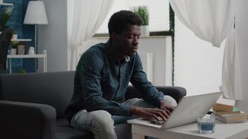 Working from home black man in flat apartment