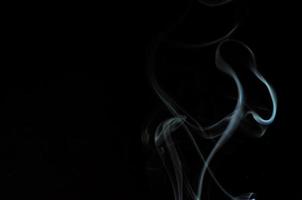 White smoke on a black background photo