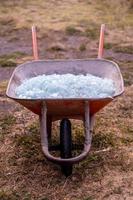 Shattered Glass in a wheel barrow photo