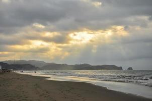 A stormy sunset on teh beach photo