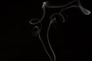 White smoke on a black background photo