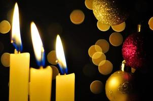 Candles and baubles at Christmas time photo