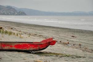 CA red canoe on the beach