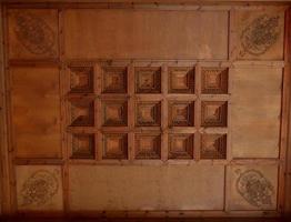 Wooden ceiling with geometric shapes panels photo