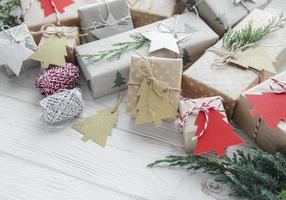 Christmas  decorative homemade gift boxes wrapped in brown kraft paper photo