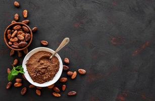 Bowl with Cocoa powder and beans photo