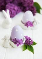 Spring lilac flowers and easter eggs photo