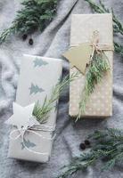 Christmas presents on gray knitted textile background. photo