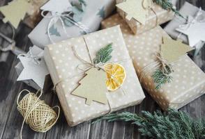 Christmas  decorative homemade gift box wrapped in brown kraft paper photo