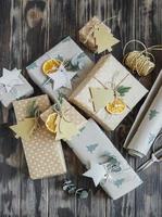 Christmas  decorative homemade gift box wrapped in brown kraft paper photo