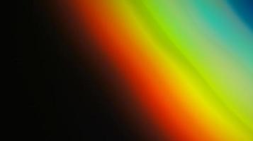 rainbow light overlay refraction texture diagonal natural holographic on black. photo