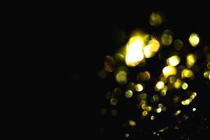 light yellow abstract pattern glitter stardust sparkling lights grunge on black. photo