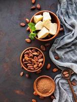 Cocoa beans, powder and butter photo