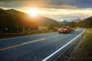 light truck passing highway of aspiring national park most popular traveling destination in west coast southland of new zealand photo