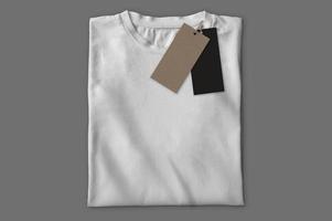 White folded t-shirt with labels photo