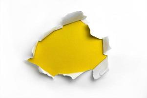 White ripped paper in yellow background