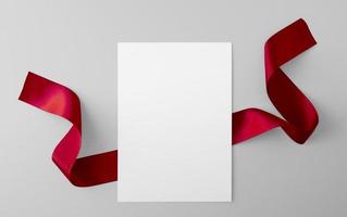 Paper Sheet with Red Ribbon photo