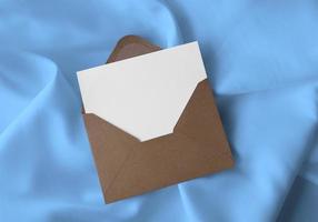 Envelope With Card On Fabric Background