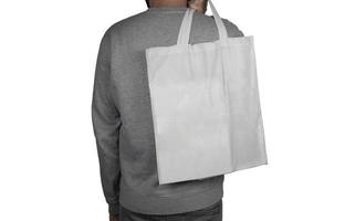 Model with a tote bag over white surface photo