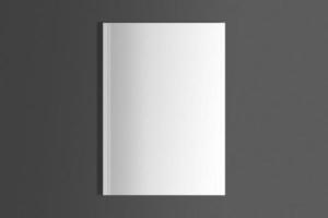 Isolated white magazine over black surface photo