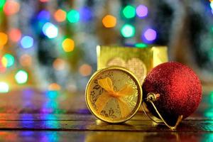 gift boxes on wooden table, christmas decoration, blurred lights photo