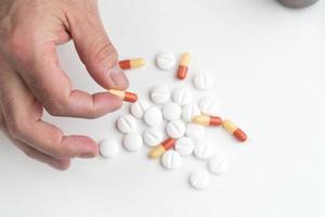 Medication capsule in hand photo