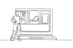 Continuous one line drawing young man choosing shopping items on a giant laptop screen. Sale, digital lifestyle with internet and gadgets concept. Single line draw design vector graphic illustration