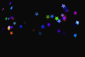 light colorful blue star little effect isolated overlay glitter texture on black. photo