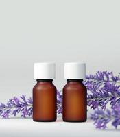 Essential oil bottle mock up. With lavender flower. White background. Body care and aromatherapy concept. 3D illustration.