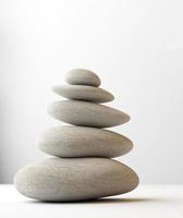 stack of white balanced zen spa stones isolated. white background. 3d illustraton photo