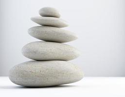 stack of white balanced zen spa stones isolated. white background. 3d illustraton photo