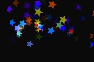 Efecto de luz de estrella azul de colores claros textura de brillo de superposición aislada en negro. foto