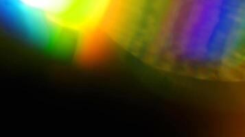 rainbow yellow light overlay refraction texture diagonal natural holographic on black. photo