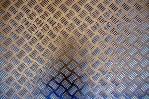 Background texture of metal with repetitive pattern photo