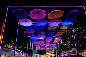 The colorful umbrella in night event outdoor in park photo