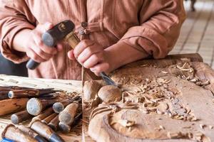 Craftsman wood carving. photo