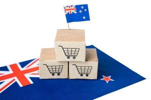 Shopping cart logo with New Zealand flag, Shopping online Import Export eCommerce finance business concept. photo