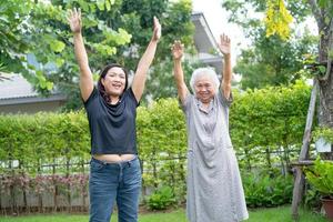 Asian senior or elderly old lady woman patient exercise with happy fresh enjoy in park, healthy strong medical concept photo