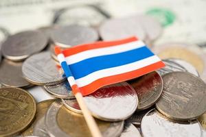 Stack of coins with Thailand flag on white background. photo