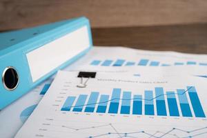Binder data finance report business with graph analysis in office. photo