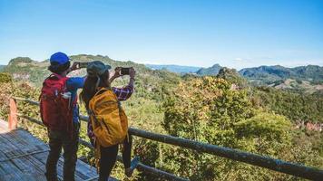 Travel, nature travel of Asian couples while is relaxing outdoors during his trip in Thailand. photo