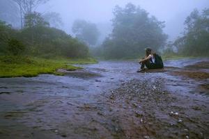 Girl walking traveling adventure nature in the rain forest. travel nature, Travel relax, Travel Thailand, rainy season. Phu Hin Rong Kla National Park photo