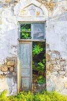Old abandoned broken dirty houses buildings texture Rhodes Greece.