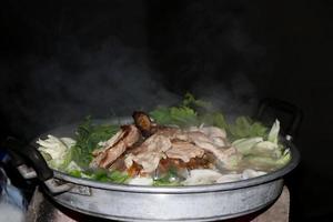 Thai Barbecue Buffet with smoke on the black background photo