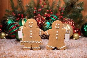 Family of Gingerbreads with kids on Holiday Christmas Background photo
