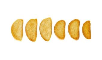 Crackers made of wheat bread on white background. photo