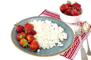 Healthy food. Fresh homemade cottage cheese and strawberries. photo