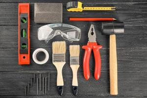 Set of tools on wooden background photo