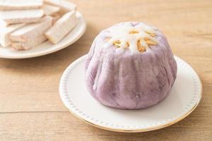 taro bun with white sugar cream and nut photo