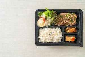 Japanese rice with pork yaki bento set photo